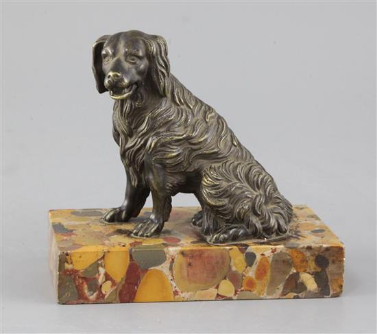 A Victorian bronze model of a seated spaniel, height 5.5in.